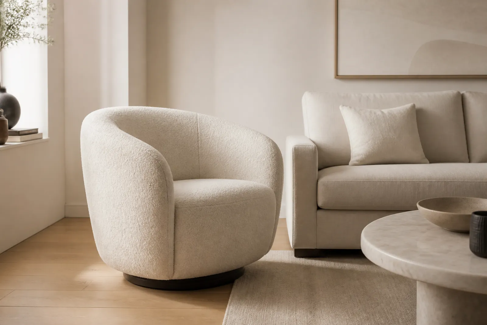 Cream boucle swivel barrel chair in a bright modern living room